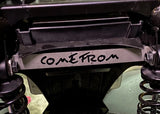Close-up of a mechanical component with 'COME FROM' engraved on it.